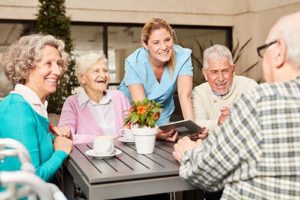 a group of people enjoying senior living community amenities venice fl